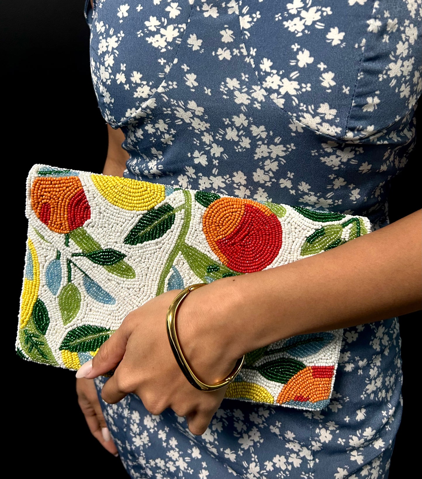 A multicolored clutch bag with a fruit design with beads new zealand